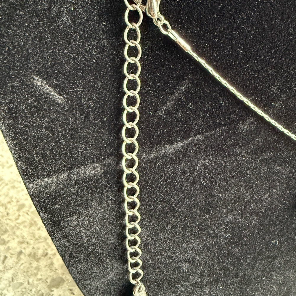 Elegant Silver Cross Pendant Necklace with Faceted Black Stones - Picture 4 of 4